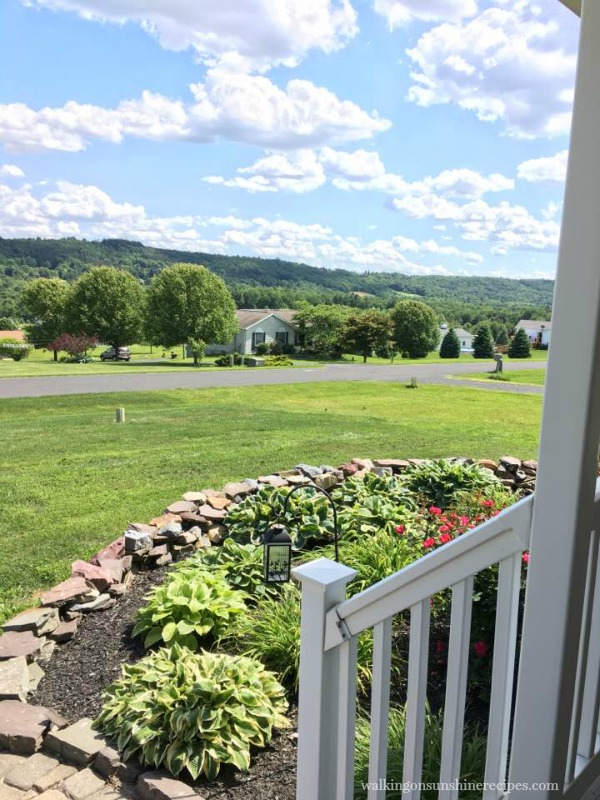View from our front porch and our hostas garden. 