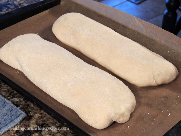 Homemade Calzones ready for the oven on baking tray.