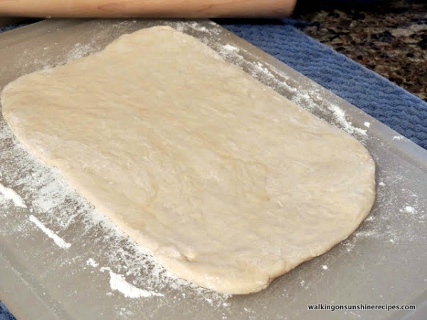 Roll out the pizza dough.