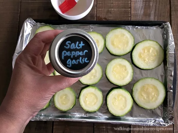 Sliced zucchini on tray for Zucchini Pizza Bites from Walking on Sunshine