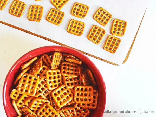 Lay square pretzels on baking tray for Hugs Pretzel Treats from Walking on Sunshine Recipes