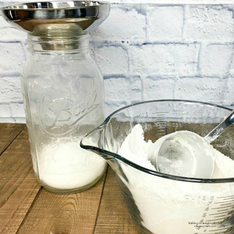 Homemade Bulk Pancake Mix using mason jars and printable labels. This makes a great gift also to give to family, teachers and friends from Walking on Sunshine Recipes. Measure ingredients for Homemade Bulk Pancake Mix