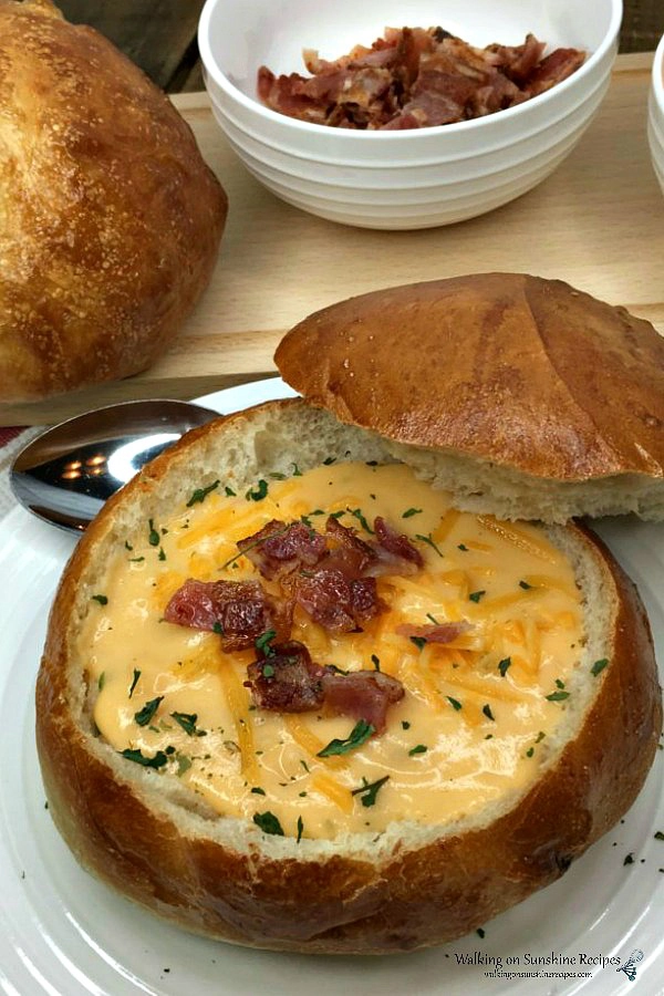 Loaded Potato Soup served in a fresh baked bread bowl with bacon on the side from WOS