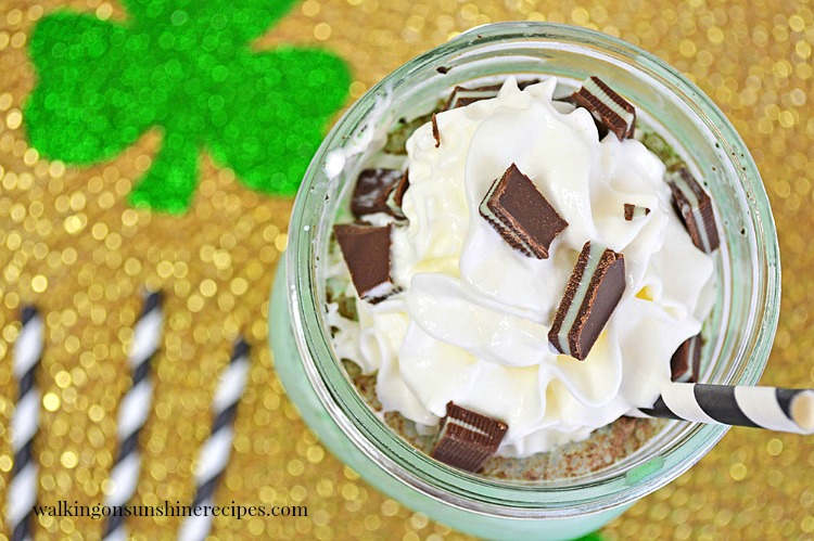 Overhead photo of Mint Chocolate Chip Ice Cream Soda with whipped cream from Walking on Sunshine Recipes. Closeup of Chocolate Chip Mint Milkshake with whipped cream and candy pieces from Walking on Sunshine Recipes
