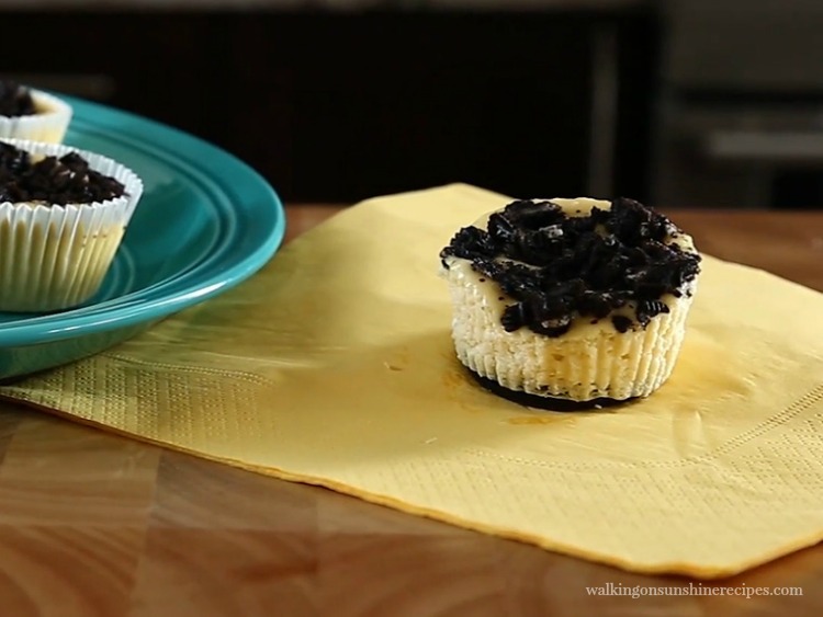 Individual Mini Oreo Cheesecakes featured photo on yellow napkin from Walking on Sunshine Recipes
