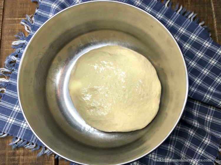 beer batter pizza dough ready or the first rise in metal bowl 