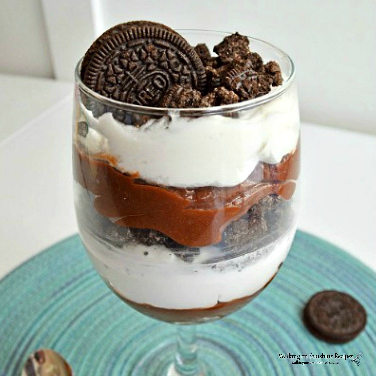 Closeup shot of Chocolate Pudding Dessert with whipped cream and Oreo cookies. 