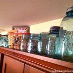 Antique Ball Jars on top of Kitchen Cabinets from Walking on Sunshine Recipes