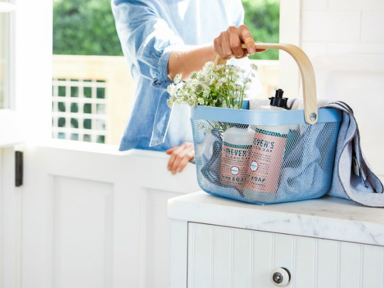 Blue basket with Mrs. Meyer's products.