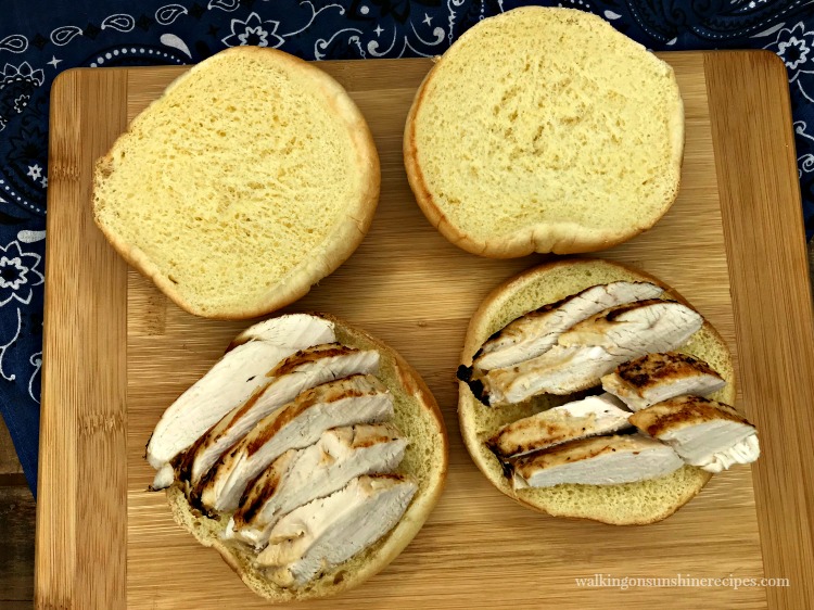 Sliced grilled chicken on buns