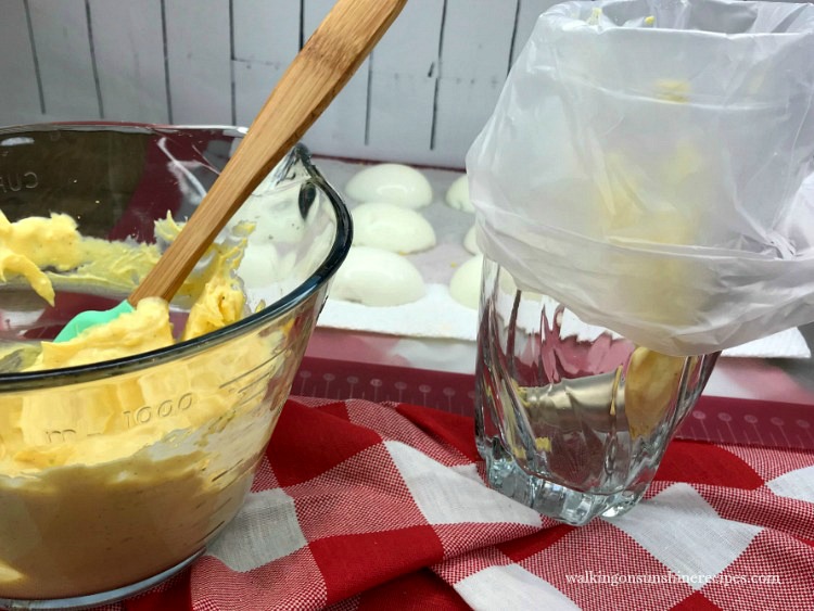 Use a pastry bag to fill the Deviled Eggs from Walking on Sunshine Recipes