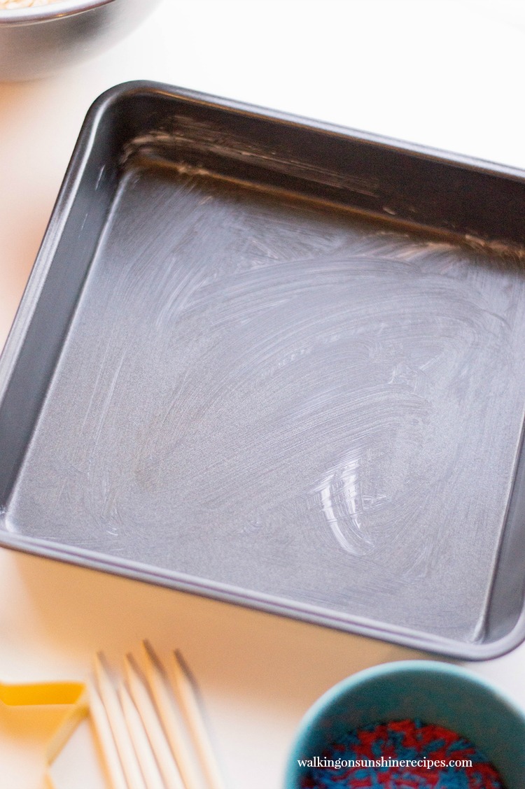 Grease a square pan well with butter before adding Rice Krispie Treats.