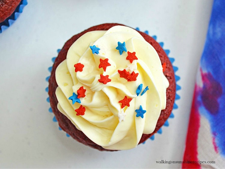 Red and Blue Sprinkle Stars on top of Homemade Red Velvet Cake with Vanilla Icing.