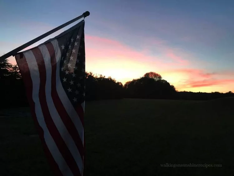 Sunset from the back porch with American Flag