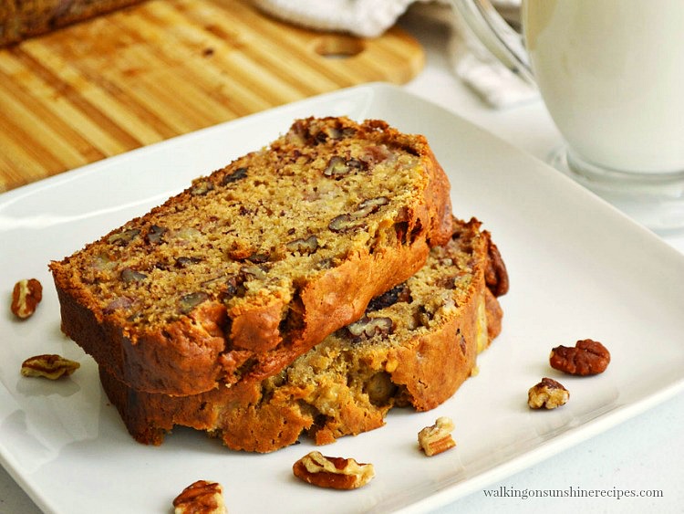 Banana Nut Bread on white plate with pecans