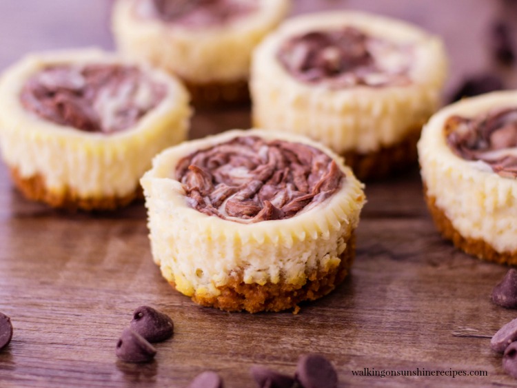 Mini Nutella Swirl Cheesecake filled with creamy cheesecake and Nutella with a graham cracker crust. You may find yourself reaching for more than just one! 