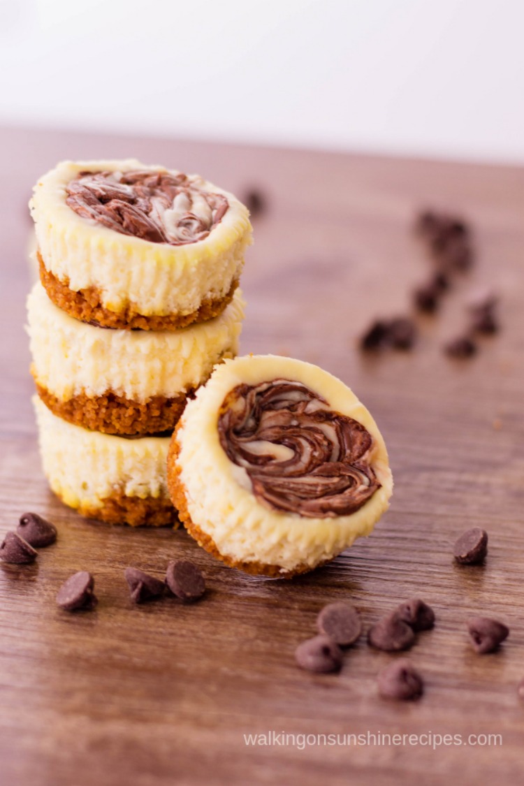 Mini Nutella Swirl Cheesecake filled with creamy cheesecake and Nutella with a graham cracker crust. You may find yourself reaching for more than just one! 