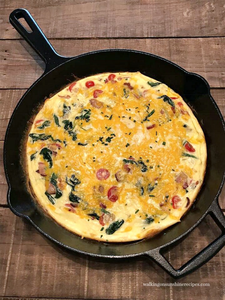 Spinach Bacon Cheese Frittata in cast iron pan.