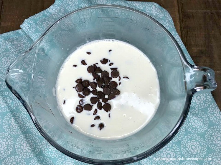 Heavy Cream and Chocolate Morsels in large batter bowl. 