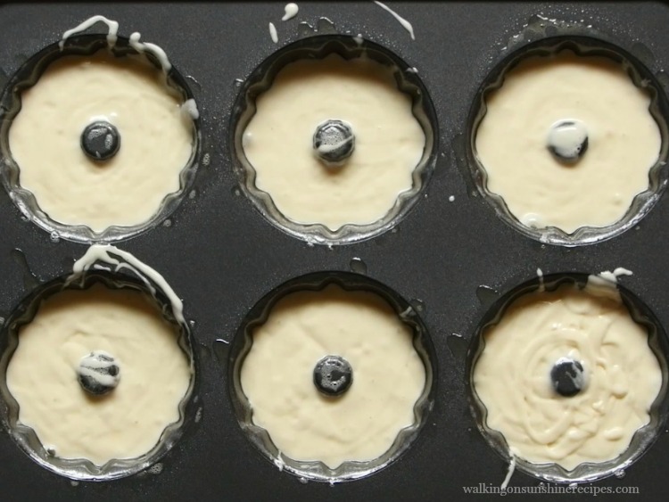 Vanilla cake batter in mini bundt pans.