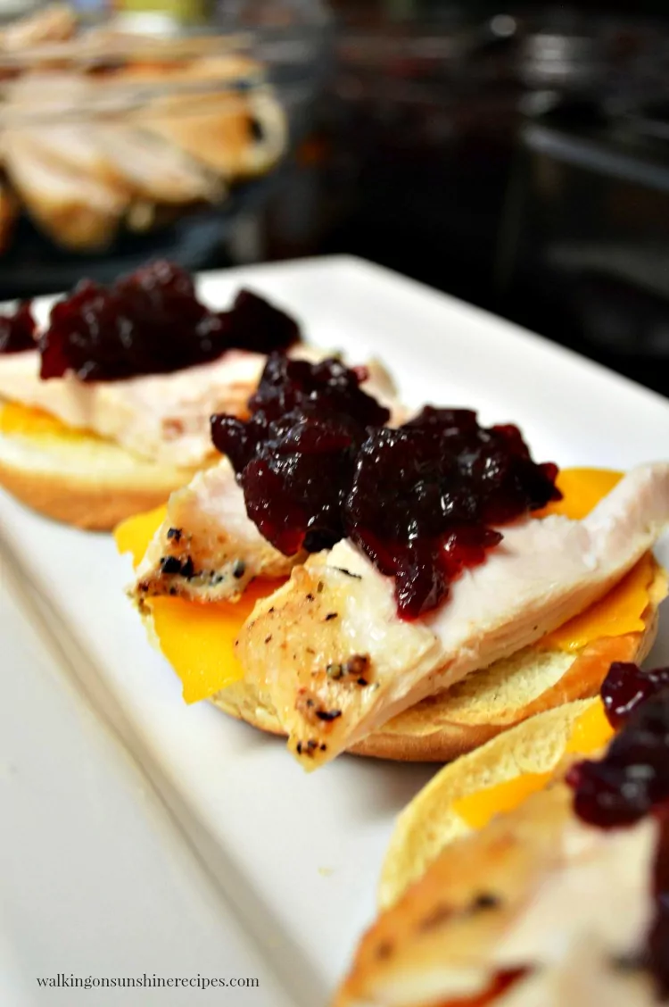 Top the leftover turkey slider sandwiches with cranberry sauce.