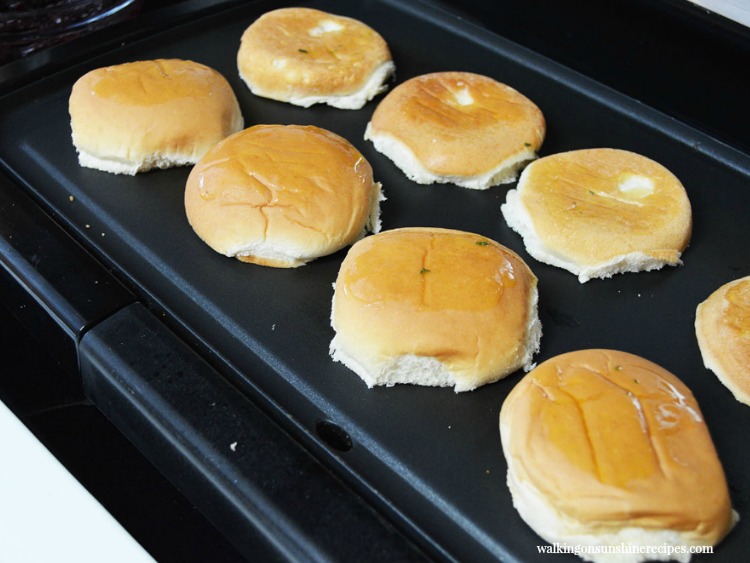 Add rolls to grill to toast. 