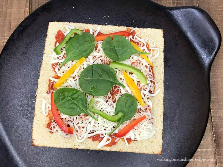 Add your favorite toppings to Cauliflower Pizza from Walking on Sunshine Recipes