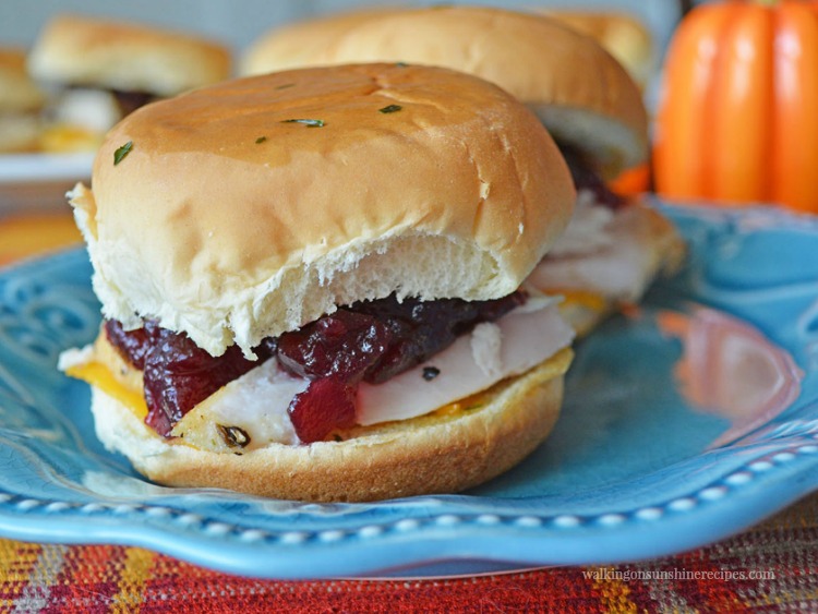 Closeup of leftover turkey slider sandwiches with turkey and cheddar cheese. 