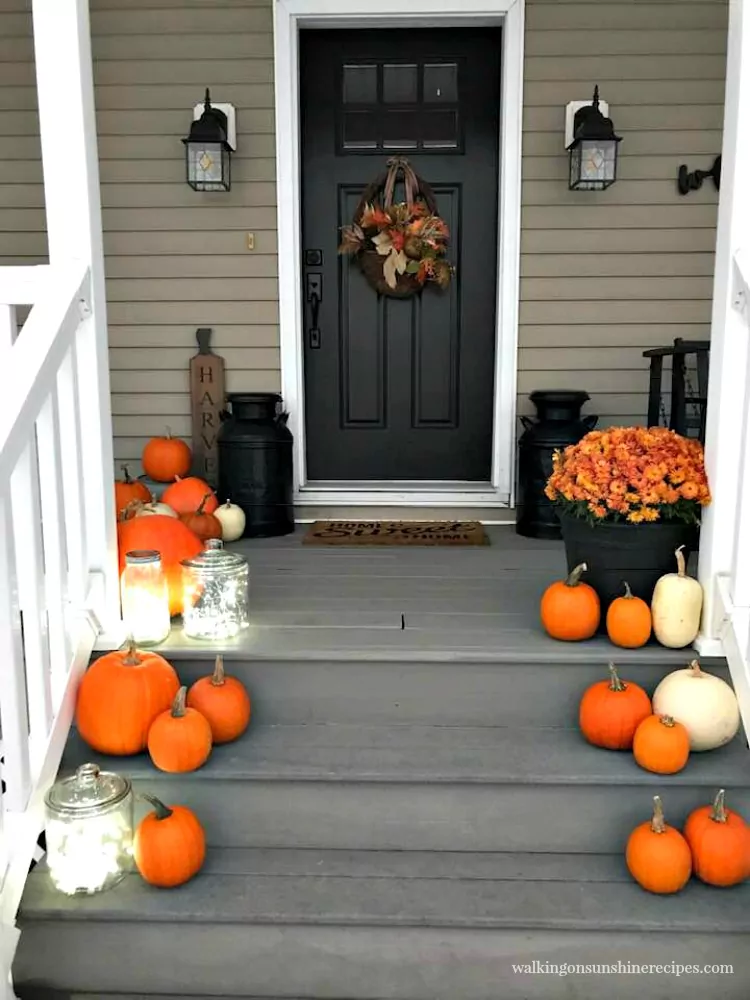 Front porch for Thanksgiving with twinkle lights from Walking on Sunshine Recipes