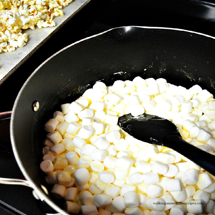 Sweet and Salty Candy Popcorn is the perfect treat for spending time with family over the holidays watching movies or playing board games! Add Marshmallows to Pot to Melt for Candy Popcorn
