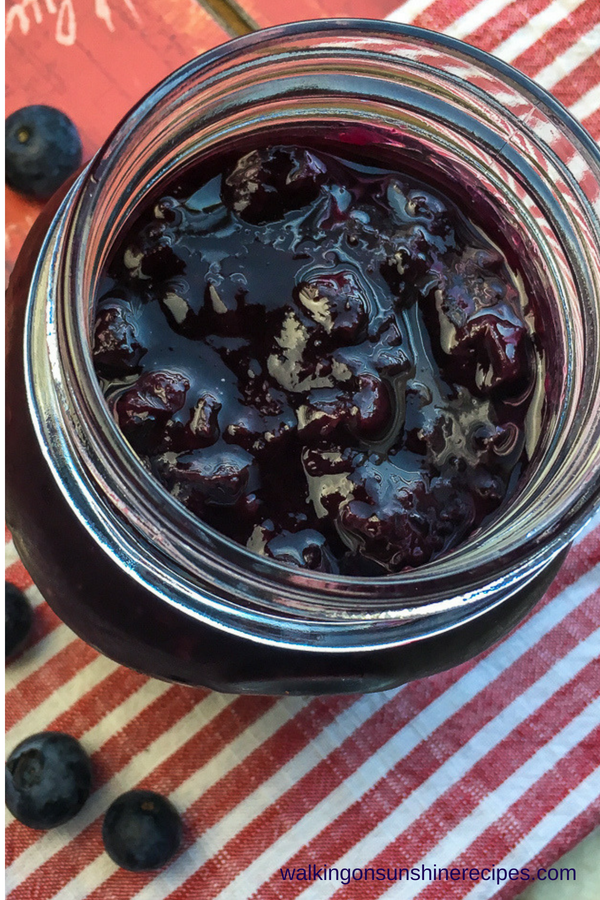 Overhead photo of Homemade Blueberry Sauce in mason jar. 