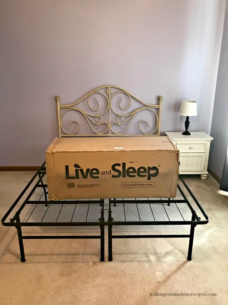 Live and Sleep Mattress in box on top of bed frame. 