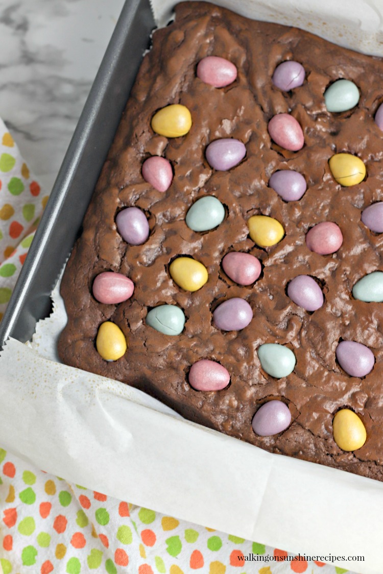 Chocolate Cadbury Egg Brownies from Walking on Sunshine Recipes mini egg brownies in baking pan.