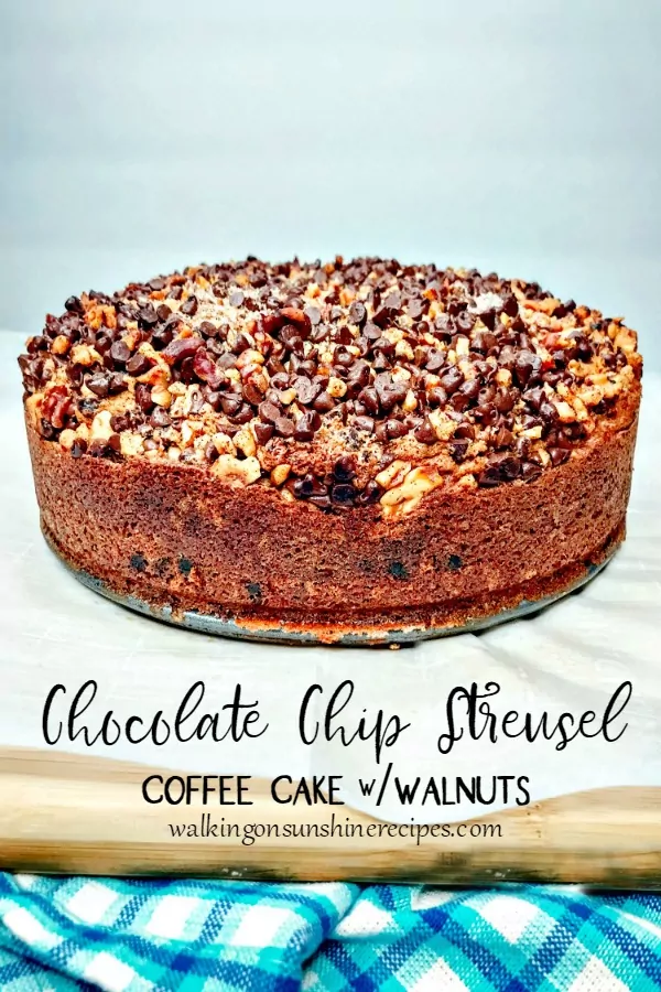 Chocolate Chip Streusel Coffee Cake with Walnuts on cutting board with blue cloth from Walking on Sunshine Recipes