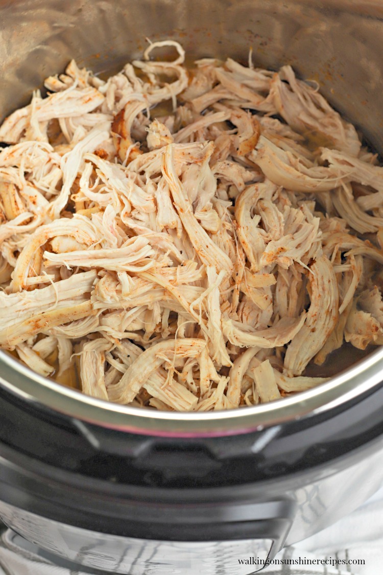 Cooked and shredded chicken in Instant Pot.