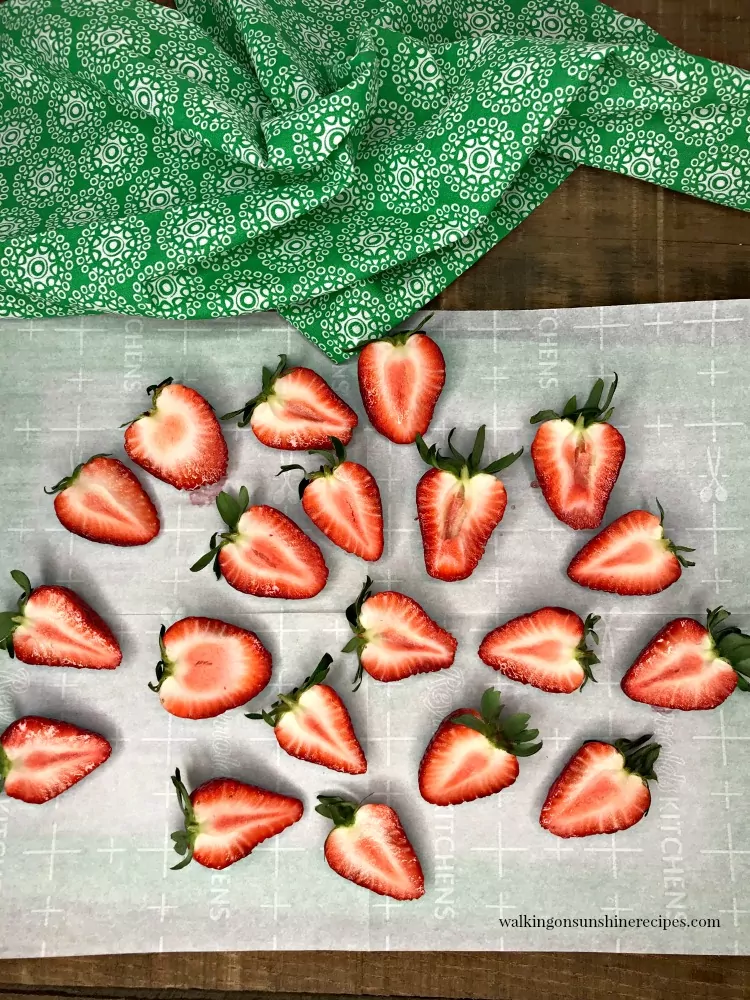 Halved Strawberries on Parchment Paper