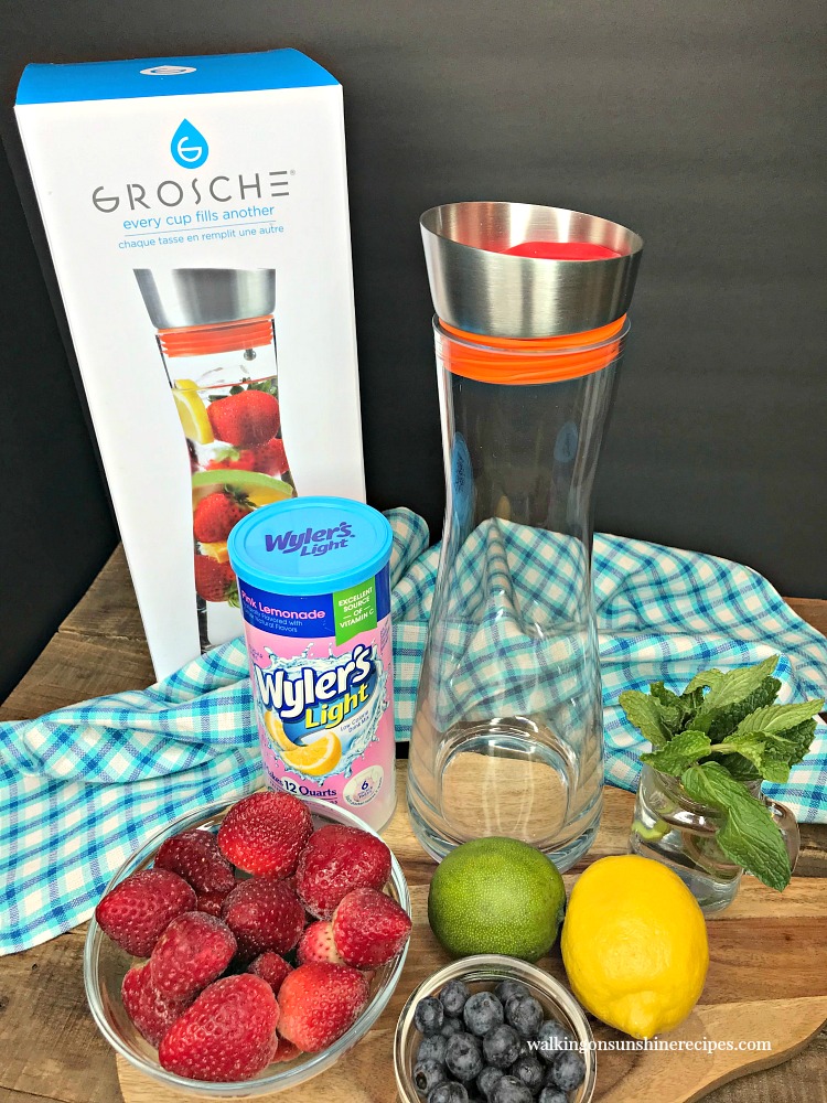 Ingredients for Strawberry Lemonade and glass infuser bottle.
