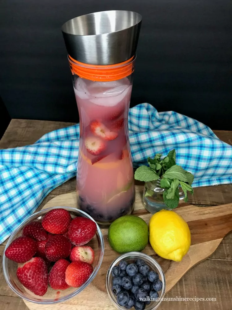 Strawberry Lemonade Punch Recipe with fresh berries, lemons, limes and mint from Walking on Sunshine Recipes