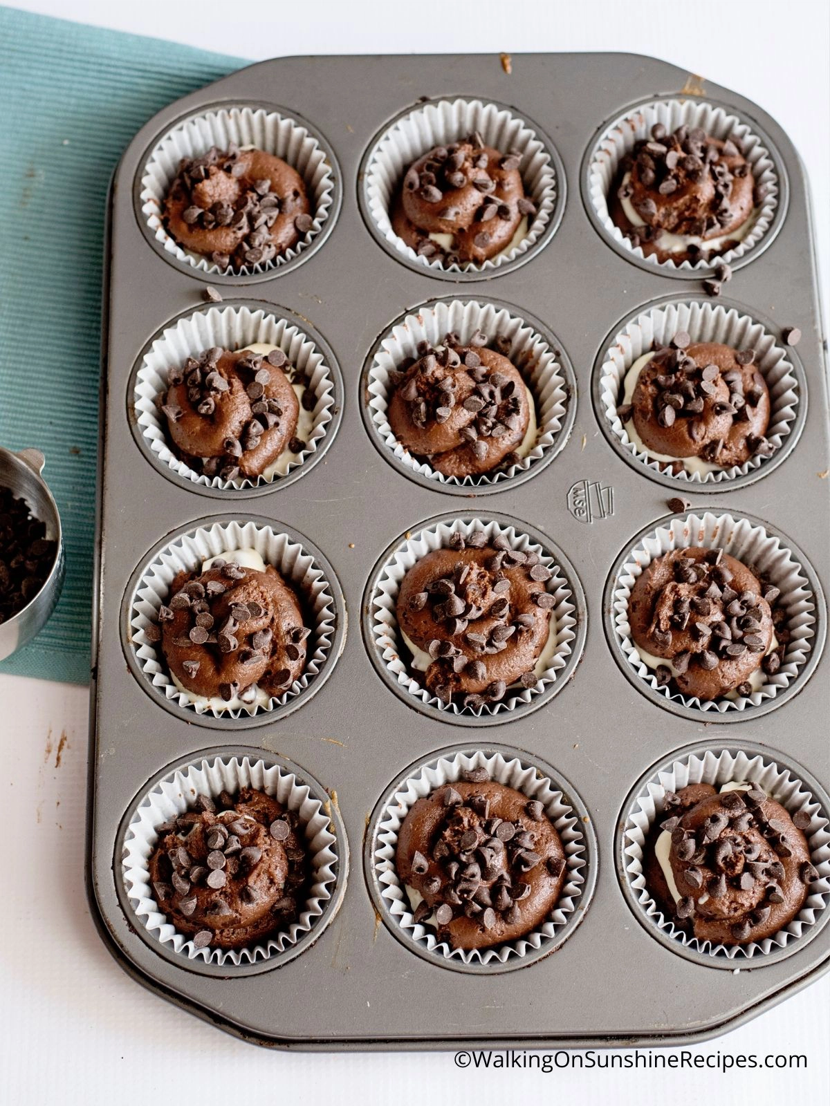 Chocolate Cheesecake Muffins in baking pan.