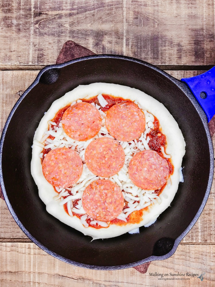 Add pepperoni to the top of Pizza