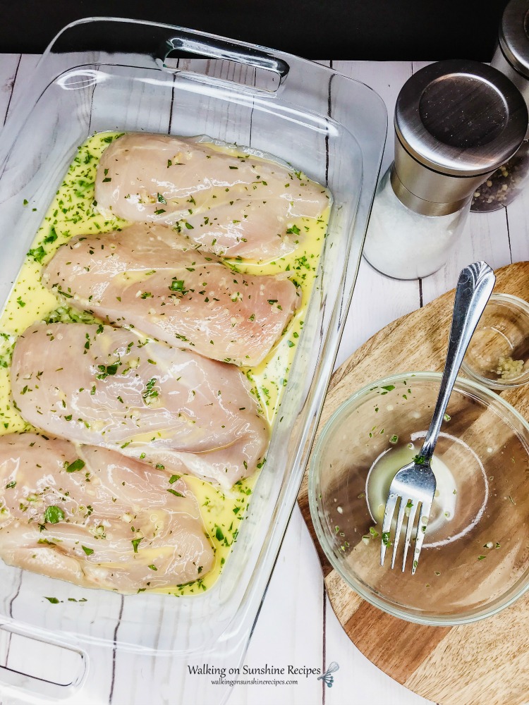 One Pan Chicken and Potatoes. is an easy sheet pan recipe your family is going to love. Crispy chicken with baby red potatoes is perfect for dinner tonight from Walking on Sunshine Recipes. Chicken marinading in garlic, lemon juice and fresh parsley from WOS