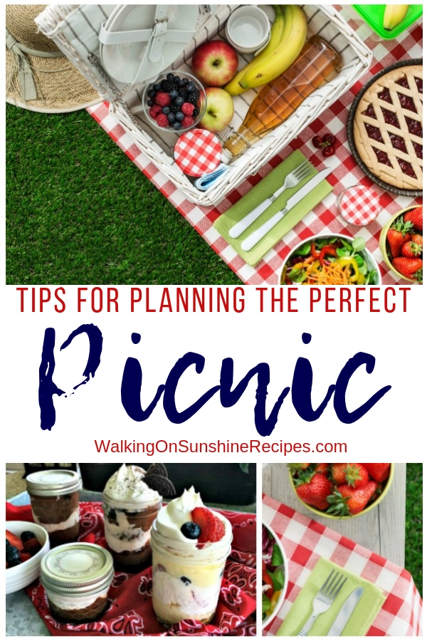 Picnic table set with delicious food for summer. 
