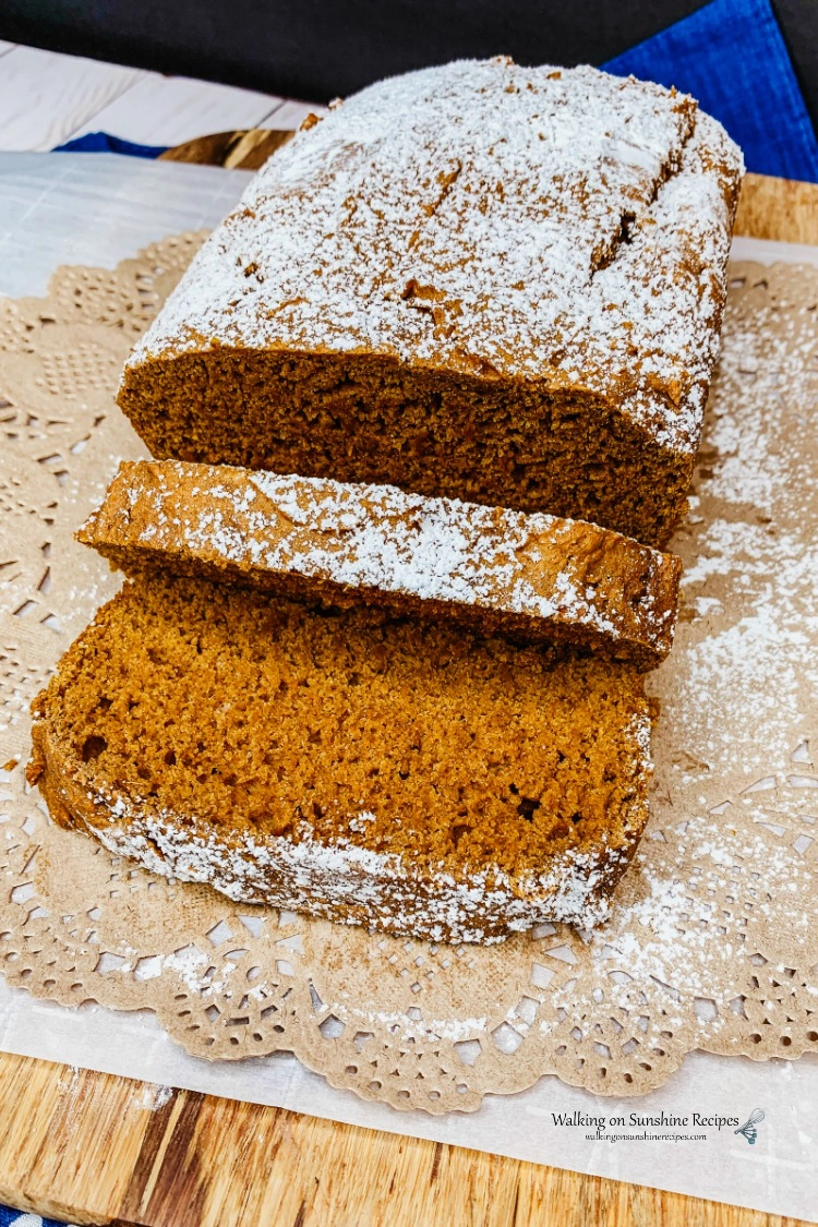2 Ingredient Pumpkin Bread on Cutting Board with powdered sugar