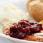 Homemade Cranberry Sauce served over slice Turkey