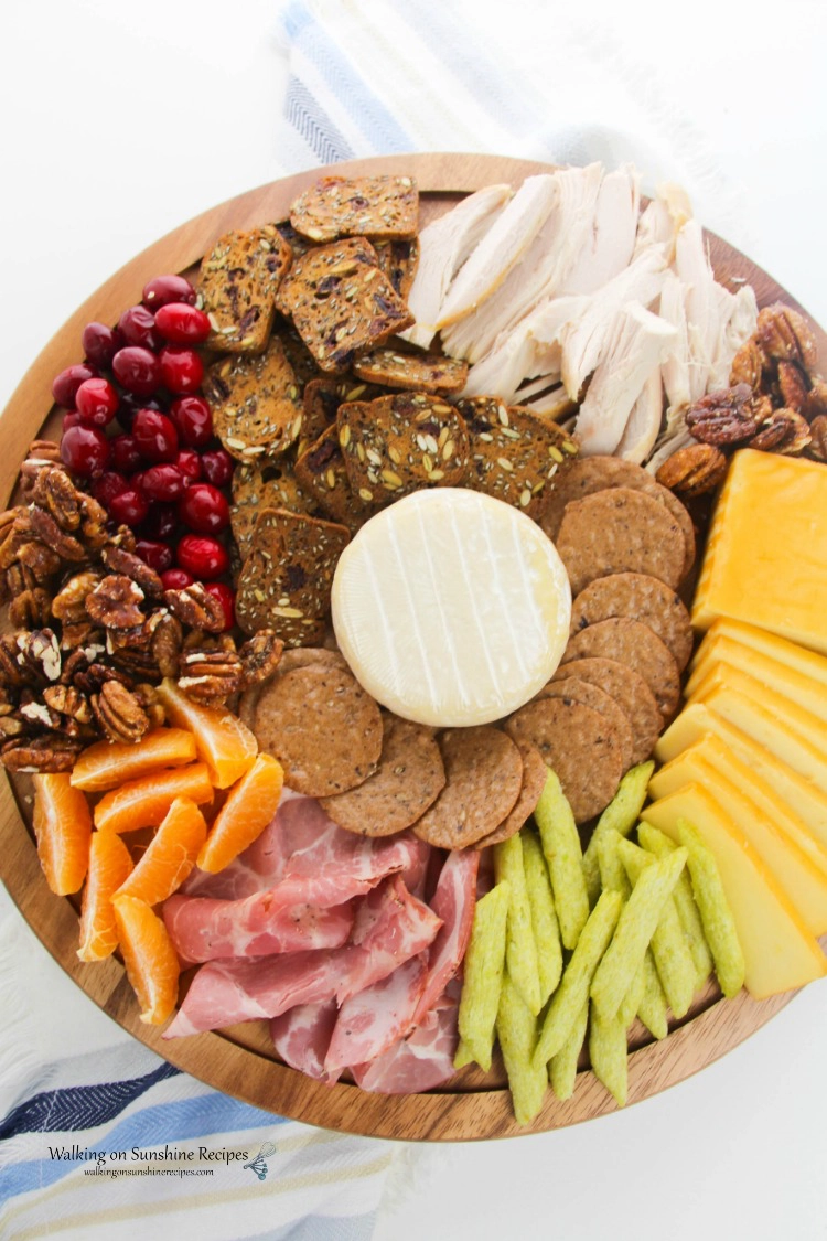 Cheese Board overhead with cheese, meats and fruits from WOS