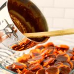 Pour caramel sauce over cooked sweet potatoes in casserole dish