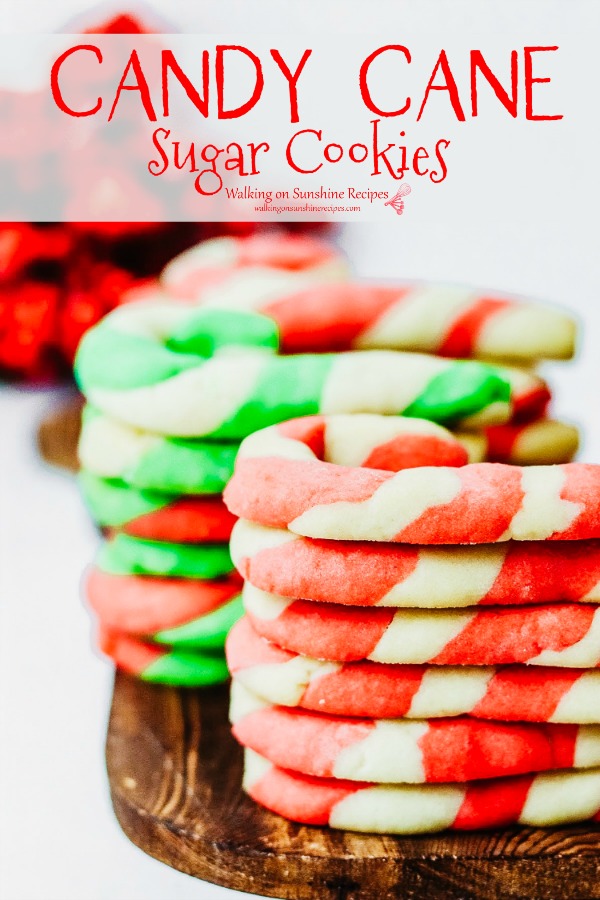 Candy Cane Sugar Cookies are a simple sugar cookie dough that's made in three colors then twisted into a pretty candy cane shape from Walking on Sunshine Recipes. Candy Cane Sugar Cookies pin from Walking on Sunshine Recipes
