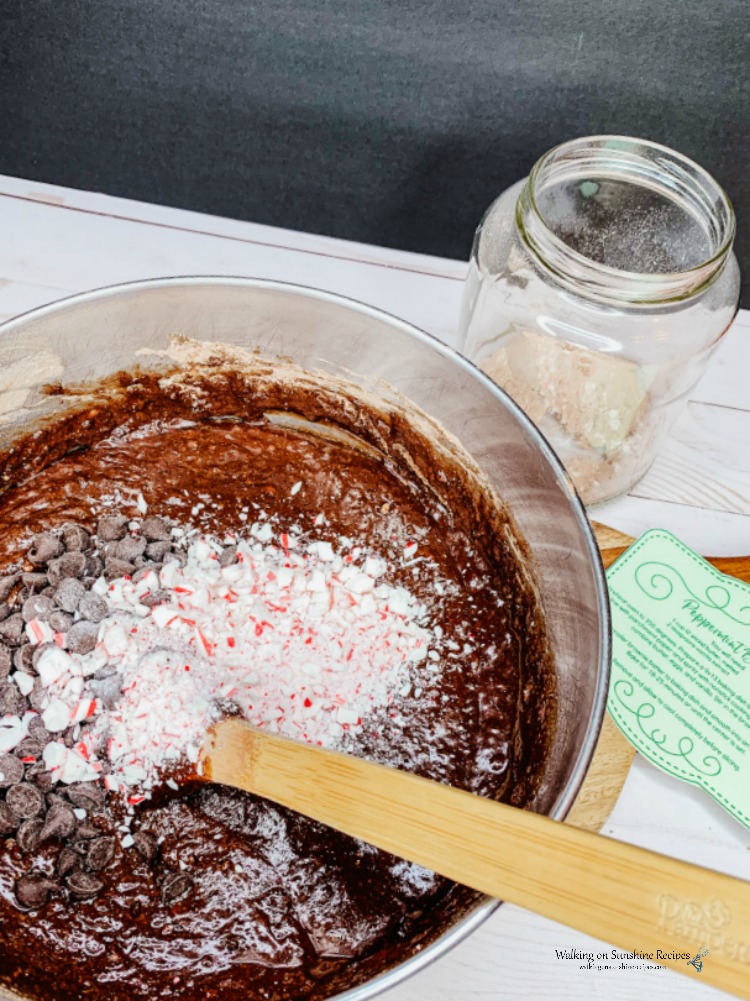 Homemade Peppermint Brownies in mixing bowl with wooden spoon