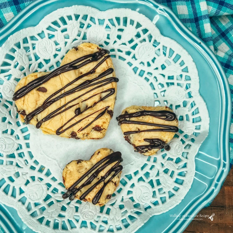 heart shaped chocolate chip cookies on blue plate
