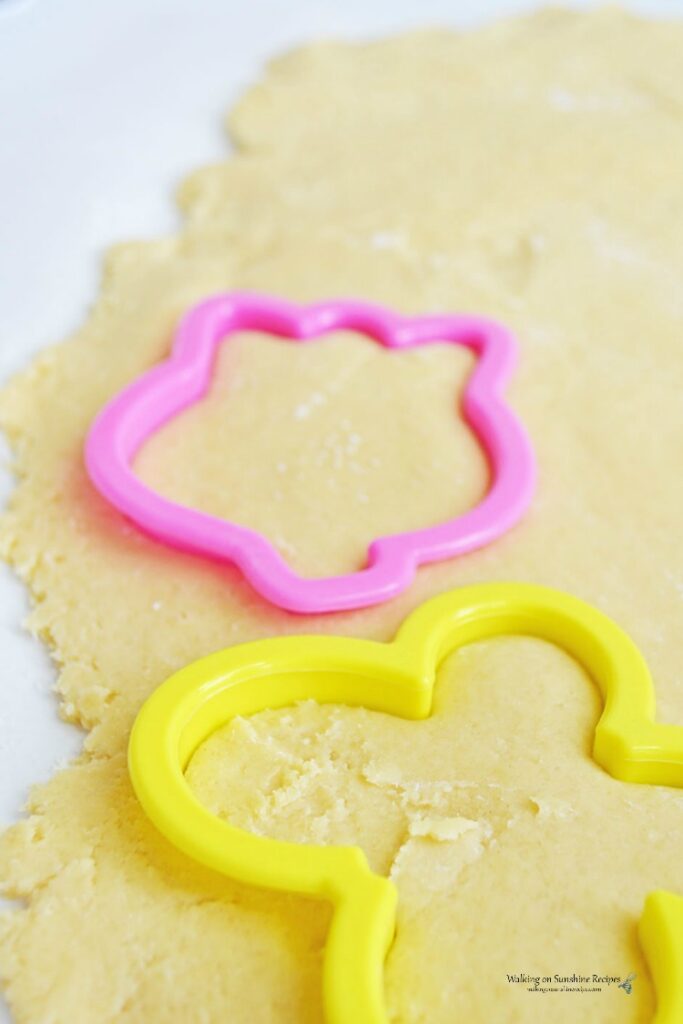 Place cookie cutters on top of sugar cookie dough that's been rolled out.
